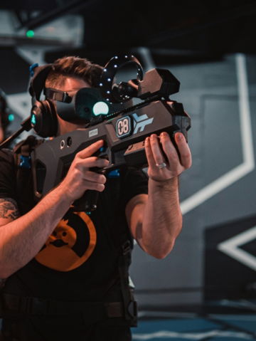 a man in a black shirt holding a video camera